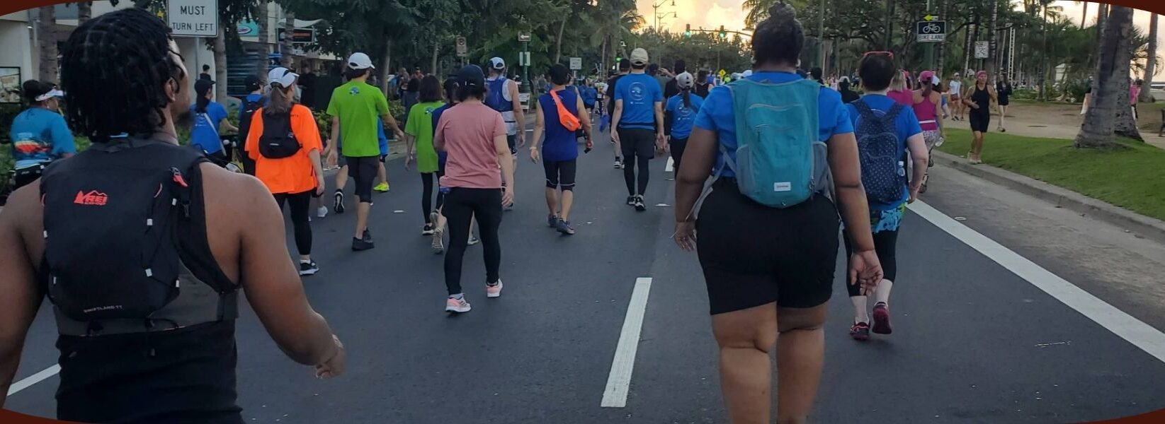 Marathon walkers of all sizes participating in the Honolulu Marathon, exemplifying inclusivity and community spirit.